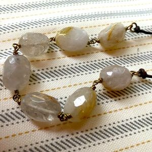 Neutral color stone and gold necklace